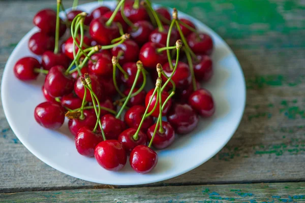 Cherry on a plate on  table — Stock Photo, Image