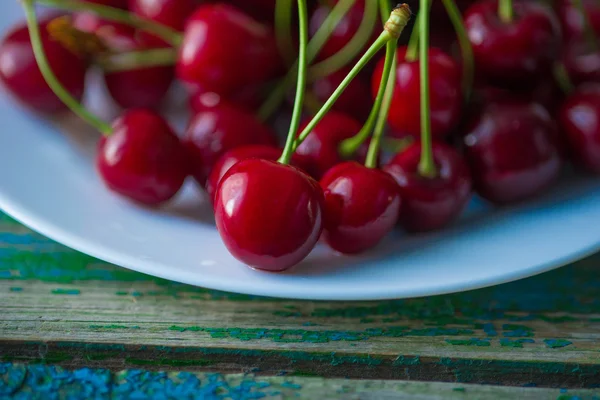 Cherry on a plate on table — Stock Photo, Image