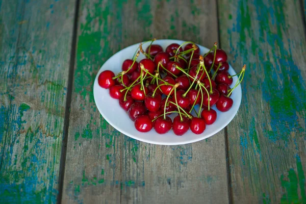 Cherry on a plate on  table — Stock Photo, Image