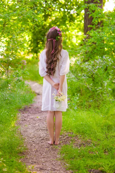 Girl with long hair in a forest — Stock Photo, Image