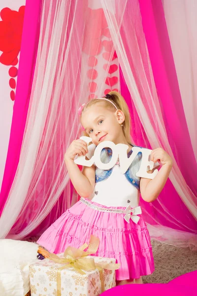 Little girl in a  pink skirt — Stock Photo, Image