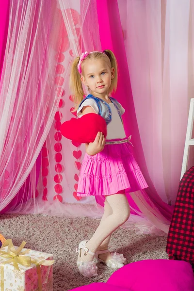 Little girl in a pink skirt — Stock Photo, Image