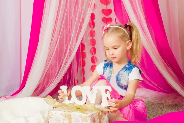 Little girl in a pink skirt — Stock Photo, Image