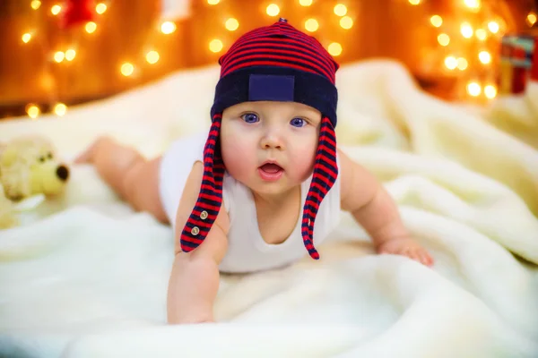 Little baby with gifts at Christmas tree — Stock Photo, Image