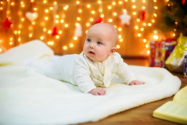 Little baby with  gifts at Christmas tree — Stock Photo, Image