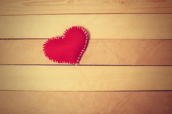 Textile red heart  on  wooden texture — Stock Photo, Image