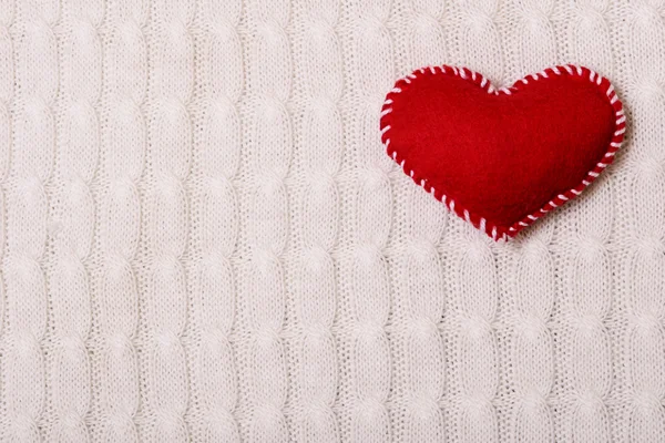 Textile red heart on a  knitted texture — Stock Photo, Image
