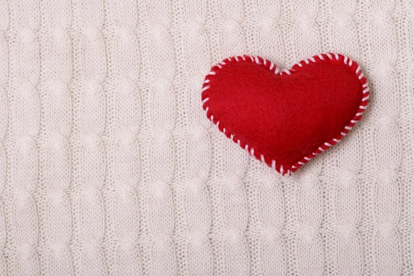 Textile red heart on a  knitted texture — Stock Photo, Image