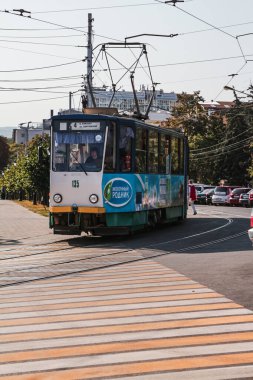 Pyatigorsk, Russia, September 23, 2020: tram number 4 crosses the pedestrian crossing and turns from Kirov Avenue to Sobornaya Street clipart