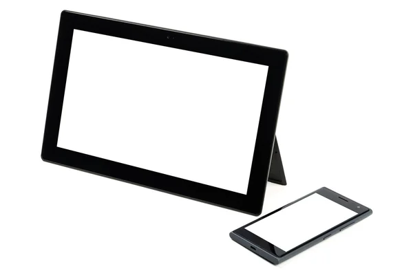 Tableta negra moderna con teléfono celular aislado —  Fotos de Stock
