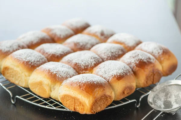 Sweet bread rolls with powdered sugar on top