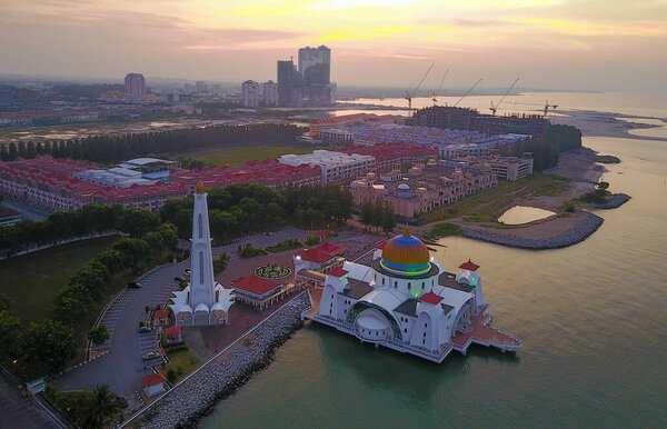 Aerial view of Majestic Malacca Straits Mosque during sunrise