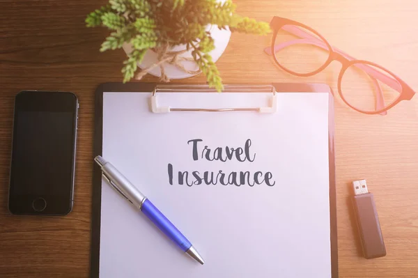 Концепция Бизнеса Top View Notebook Writing Travel Insurance — стоковое фото