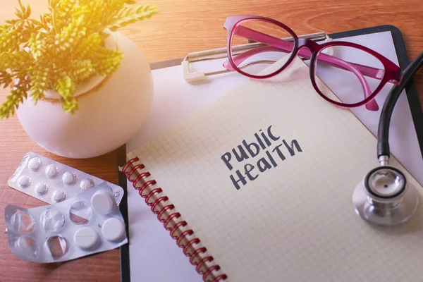 Stethoscope on note book with Public Health words as medical concept