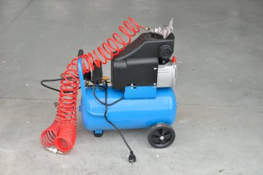 Blue pump compressor for washing cars, indoor. Cleaning concept. clipart