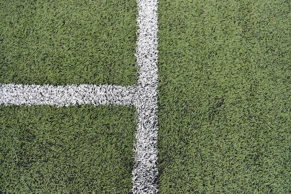 Detail gekreuzter weißer Linien auf einem Fußballplatz. Nahaufnahme — Stockfoto