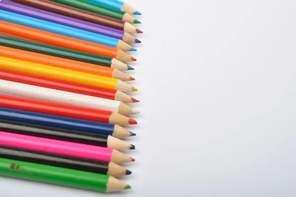 Close up picture of many little colored pencil crayons on white — Stock Photo, Image