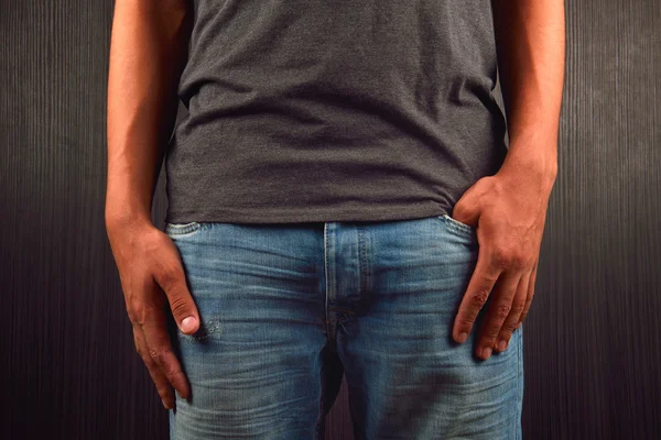 Close up of hands and the left hand with big finger in a pocket — Stock Photo, Image