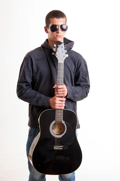 Image of teenager in black clothes, hoodie and sunglasses who is — Stock Photo, Image