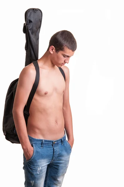 Young guitarist wearing no top with his acoustic guitar on back — Stock Photo, Image