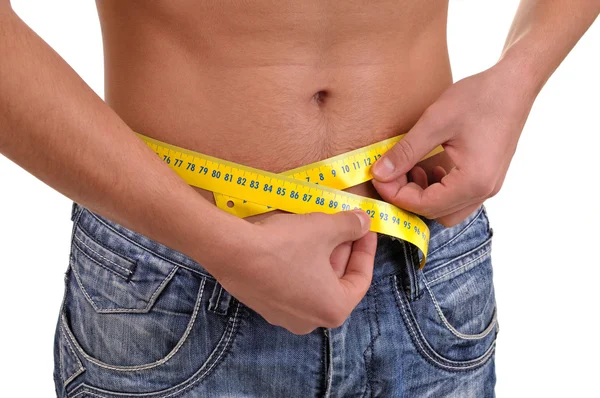 Close up with a waist and metter. Slim fit concept. Young fitnes — Stock Photo, Image