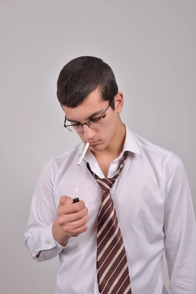 Young businessman using an asthma inhaler to handle problems wit — Stock Photo, Image