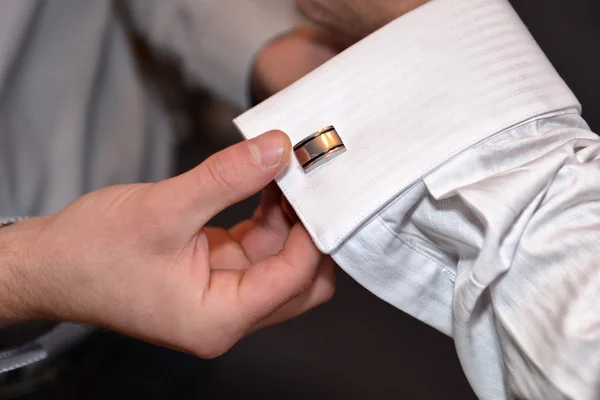 Close up of a hand man how weares white shirt and cufflink — стоковое фото