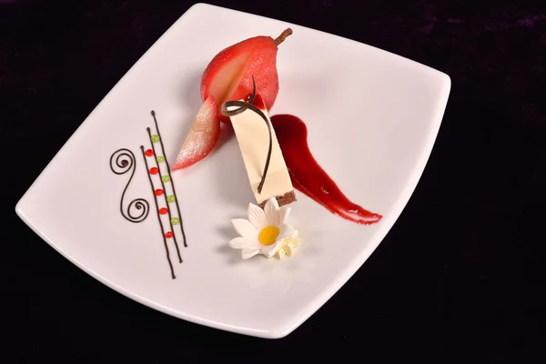 Plated dessert with poached pears in white porcelain plate — Stock Photo, Image