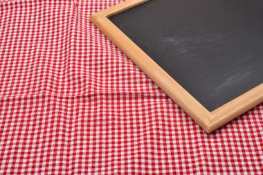 Blank blackboard in a rustic setting with copy space for text