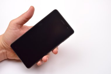 Male hand holding blank mobile smartphone with clipping path for