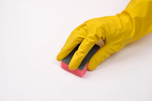 Women protecting hand with rubber glove from detergents as they — Stock Photo, Image