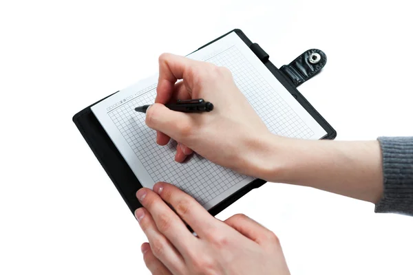 Mão escrever no notebook sobre fundo branco — Fotografia de Stock