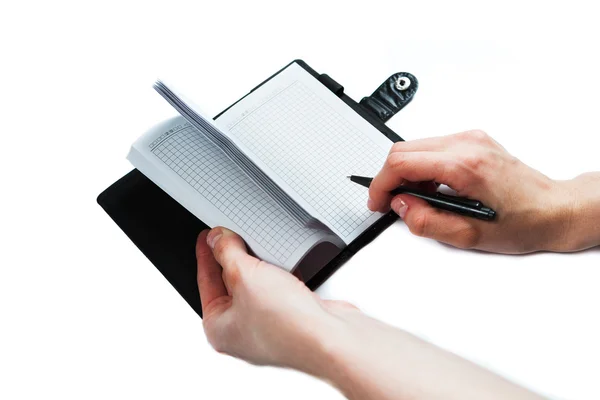 Hand skriva på anteckningsboken på vit bakgrund — Stockfoto