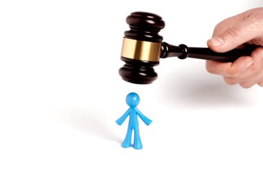 Toy man and judge gavel isolated on white background. The concept of unfair judgments. Antipopular court. injustice clipart