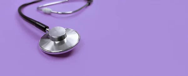 Black Stethoscope Purple Background Copy Space — Stock Photo, Image