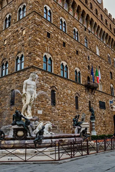 stock image Palazzo Vecchio building and fountain of Neptune in Piazza della Signoria, Florence, Italy. 