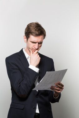 studio shot of thoughtful businessman