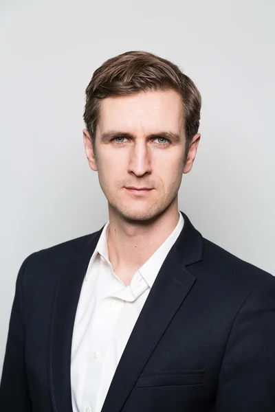 studio shot of thoughtful businessman