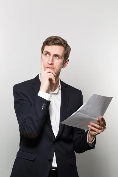 Studio shot of thoughtful businessman — 图库照片