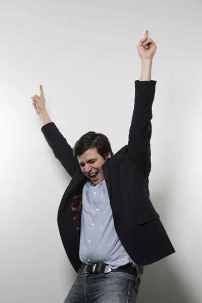 Studio shot of happy businessman celebrating a paper — Stok fotoğraf