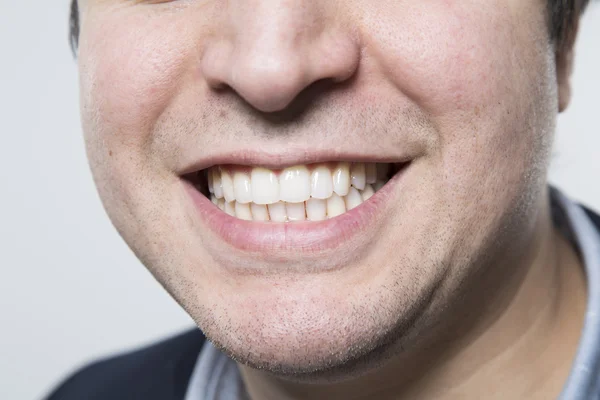 Studio shot of happy person and white teeth — Stockfoto