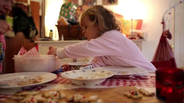 Girl helping with cookie preparation on advent first — Stock Video