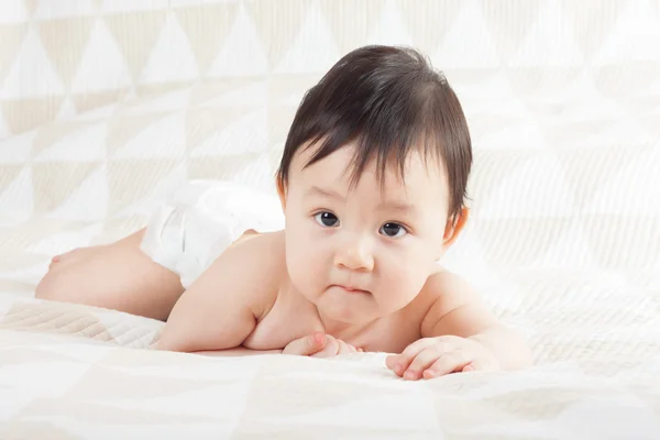 Baby on the bed — Stock Photo, Image