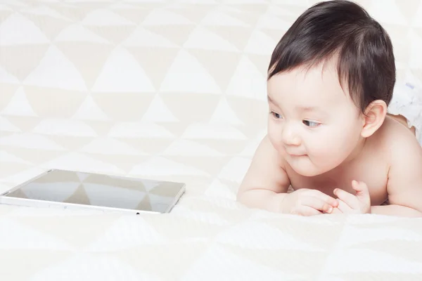 baby and tablet PC