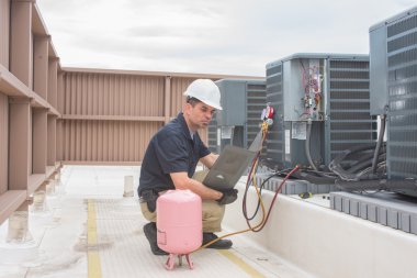 HVAC Technician with panel clipart