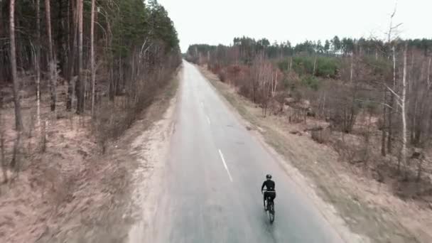 Cyclist on bicycle. Professional athlete riding on road bike. Exercises workouts — Stock Video