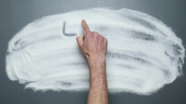 Male hand writes words low sugar on sugar background. Stop diabetes. Sugar kills — Stock Video