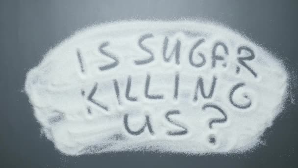 Hand erased text Is sugar killing us? Obesity. Stop diabetes. Unhealthy food — Stock Video