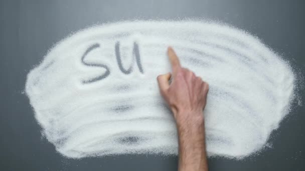 Sugar kills U written on surface of sugar. Hand writing words Sugar kills you — Stock Video