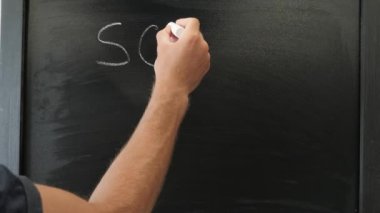 School is coming written on chalkboard. Education concept